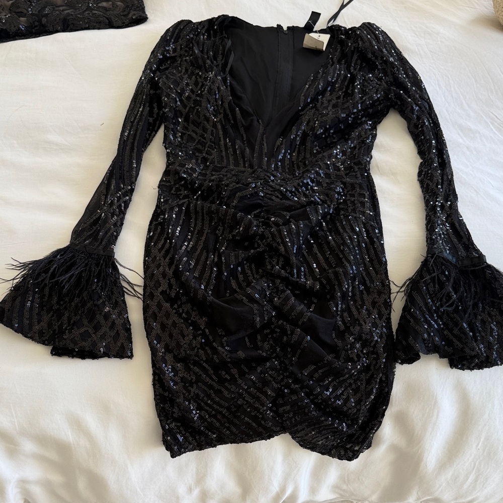 Black sequin and feather dress